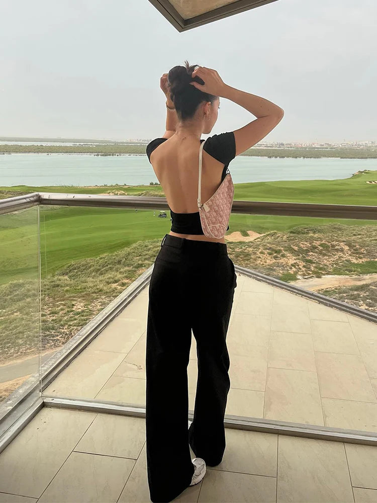 Women’s O-neck Backless T-shirt: A Symphony of Youthful Grace