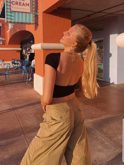 Women’s O-neck Backless T-shirt: A Symphony of Youthful Grace